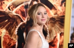 FILE - Jennifer Lawrence arrives at the Los Angeles premiere of "The Hunger Games: Mockingjay - Part 1" at the Nokia Theatre L.A.