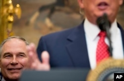 FILE - EPA administrator Scott Pruitt listens as President Donald Trump speaks in the Roosevelt Room of the White House, in Washington, Feb. 28, 2017.
