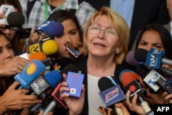 Venezuela's attorney general Luisa Ortega speaks to journalists outside the Supreme Court of Justice headquarters building in Caracas, June 13, 2017.