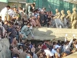 Security personnel assist with evacuation
