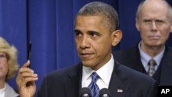 President Barack Obama gestures as he speaks at the Eisenhower Executive Office Building, Nov. 28, 2012, about how middle-class Americans would see their taxes go up if Congress fails to act to extend the middle-class tax cuts. 