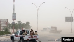 Members of UAE-backed southern Yemeni separatist forces patrol a road during clashes with government forces in Aden, Yemen, Aug. 10, 2019.