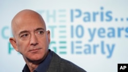 Amazon CEO Jeff Bezos speaks during his news conference at the National Press Club in Washington, Sept. 19, 2019. Bezos announced the Climate Pledge, setting a goal to meet the Paris Agreement 10 years early. 