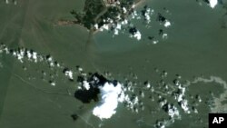 An oil slick is shown on Sept. 2, 2021, south of Port Fourchon, La. The U.S. Coast Guard said Sept. 4 that cleanup crews were responding to a sizable oil spill in the Gulf of Mexico following Hurricane Ida. (Maxar Technologies via AP)