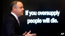 FILE - State's attorney Brad Beckworth delivers an opening statements during the opioid trial at the Cleveland County Courthouse in Norman, Oklahoma, May 28, 2019.