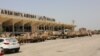 FILE - UAE military vehicles are seen at the international airport of the southern port city of Aden, Yemen.