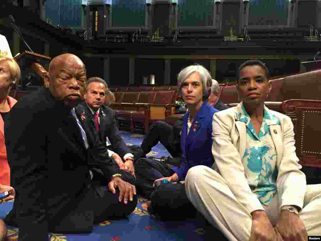 A photo tweeted from the floor of the U.S. House by Rep. Donna Edwards (R) shows Democratic members of the U.S. House of Representatives, including herself and Rep. John Lewis (L) staging a sit-in on the House floor to demand action on common sense gun legislation on Capitol Hill in Washington, D.C.