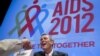 Former Senate Majority Leader Bill Frist shakes hands with a member of the audience at the XIX International AIDS Conference in Washington, July 25, 2012. 