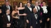 Adam Greenfield, left, and David Adjmi, center, and members of the company of "Stereophonic" accept the award for best play during the 77th Tony Awards on Sunday, June 16, 2024, in New York.
