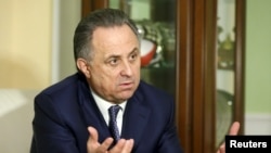 FILE - Russian Sports Minister Vitaly Mutko gestures during an interview with Reuters in Moscow, March 11, 2016. 
