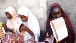 Girls and women embroider caps and other items to sell from Kawar Maila, an informal camp in Maiduguri, Nigeria. (Haruna Shehu/VOA)