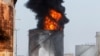 Firefighters attempt to put out a fire at the Zahrani oil facility in southern Lebanon, Oct. 11, 2021. 