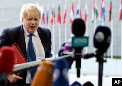 FILE - British Foreign Secretary Boris Johnson arrives for a meeting of EU foreign ministers at the EU Council building in Luxembourg, April 16, 2018.