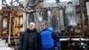 Ukrainian Energy Minister German Galushchenko, left, and International Atomic Energy Agency Director General Rafael Grossi, right, visit an energy infrastructure facility damaged during Russian missile and drone strikes in an undisclosed location in Ukraine, Feb. 4, 2025.