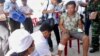 Caption: After his boat allegedly was rammed and sunk by Chinese vessels, an unidentified Vietnamese fisherman receives medical treatment on Vietnam’s Ly Son island, May 29, 2014. 