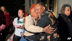 Breonna Taylor's mother, Tamika Palmer, hugs a friend in Louisville, Kentucky, on Nov. 1, 2024, after a former Kentucky police officer was convicted in federal court for using excessive force when he fired his gun during the deadly raid that left Taylor dead in 2020.