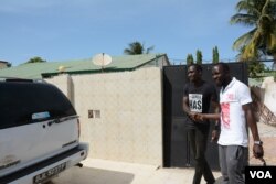 A friend of Tijan Barrow, left, wears one of Barrow's more popular t-shirts.