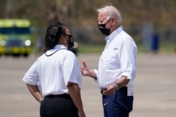FILE - President Joe Biden talks with New Orleans Mayor LaToya Cantrell as he arrives at Louis Armstrong New Orleans International Airport in Kenner, Louisiana, Sept. 3, 2021, to tour damage caused by Hurricane Ida.