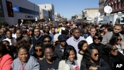 A large crowd forms near a stage where President Barack Obama will speak in Selma, Alabama.