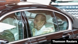 Britain's Prince Philip leaves the King Edward VII hospital in the back of a car in London, March 16, 2021.