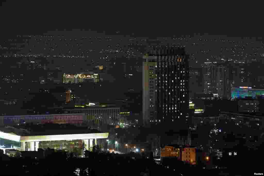 The hotel "Kazakhstan" is seen after the lights are switched off for Earth Hour in Almaty, Kazakhstan, March 30, 2019.