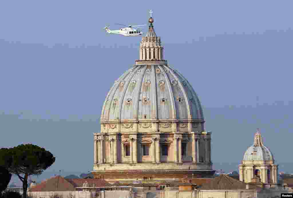 A helicopter carrying Pope Benedict takes off from inside the Vatican on its way to the papal summer residence at Castel Gandolfo, Feb. 28, 2013.