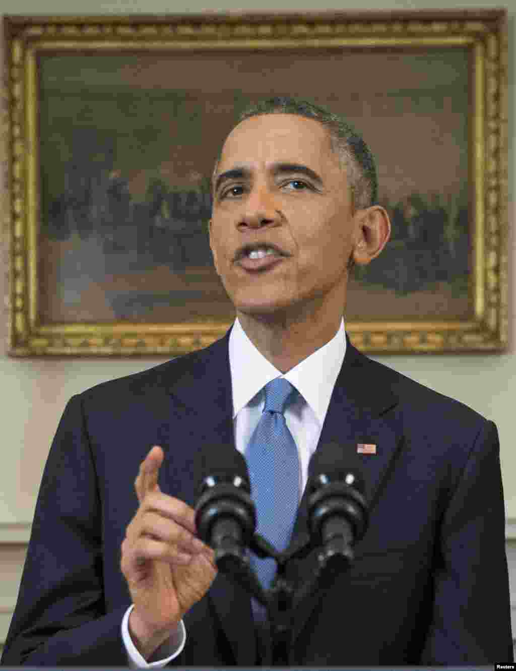 President Barack Obama announces a shift in policy toward Cuba while delivering an address to the nation from the Cabinet Room of the White House in Washington, Dec. 17, 2014.
