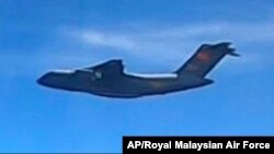 This handout photo from the Royal Malaysian Air Force taken on May 31, 2021 and released on June 1, 2021 shows a Chinese People's Liberation Army Air Force (PLAAF) Xian Y-20 aircraft.