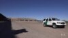 Border Town View of US Troops and Caravan