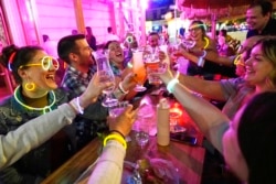 Friends from a church group gather at the Tiki Bar on Manhattan's Upper West Side, in New York, May 17, 2021.