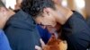 Austin Burden, 17, cries on the shoulder of a friend after a vigil at the Parkland Baptist Church, for the victims of the Wednesday shooting at Marjory Stoneman Douglas High School, in Parkland, Fla., Feb. 15, 2018. 