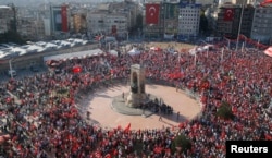 FILE - Supporters of various political parties gather in Istanbul's Taksim Square during a rally organized by main opposition Republican People's Party (CHP) in Turkey, July 24, 2016.