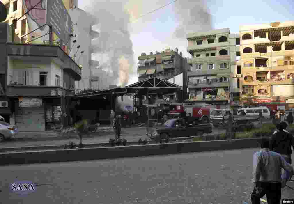 The site of a blast in Jaramana district, near Damascus, is seen in this handout photograph released by Syria&#39;s national news agency SANA, November 28, 2012. 