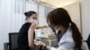 South Korean Olympic table tennis player Jeon Ji-Hee receives the first dose of the Pfizer-BioNTech coronavirus vaccine at the National Medical Center in Seoul, South Korea, April 29, 2021.