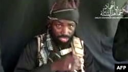 This screen grab image taken on September 25, 2016 from a video released on Youtube by Islamist group Boko Haram shows Boko Haram leader Abubakar Shekau making a statement at an undisclosed location. 