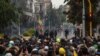 Riot police and demonstrators face off during a national protest against tax reform in Bogotá, Colombia, April 28, 2021. (Pu Ying Huang/VOA)