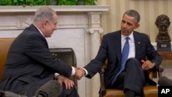 President Barack Obama and Israeli Prime Minister Benjamin Netanyahu shake hands during their meeting in the Oval Office of the White House in Washington, Monday, March 3, 2014.