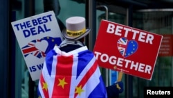 FILE - Anti-Brexit protester Steve Bray demonstrates outside of the conference center where Brexit trade deal negotiations are taking place in London, Britain, Nov. 9, 2020. 