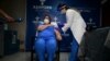 Epidemiologist Hilda Aleman reacts upon receiving the Pfizer-BioNTech COVID-19 vaccine, in San Juan, Puerto Rico, Dec. 15, 2020. 