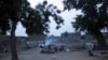 In this picture taken Saturday, July 21, 2012, children help prepare the evening meal in a courtyard in the remote village of Hawkantaki, Niger.
