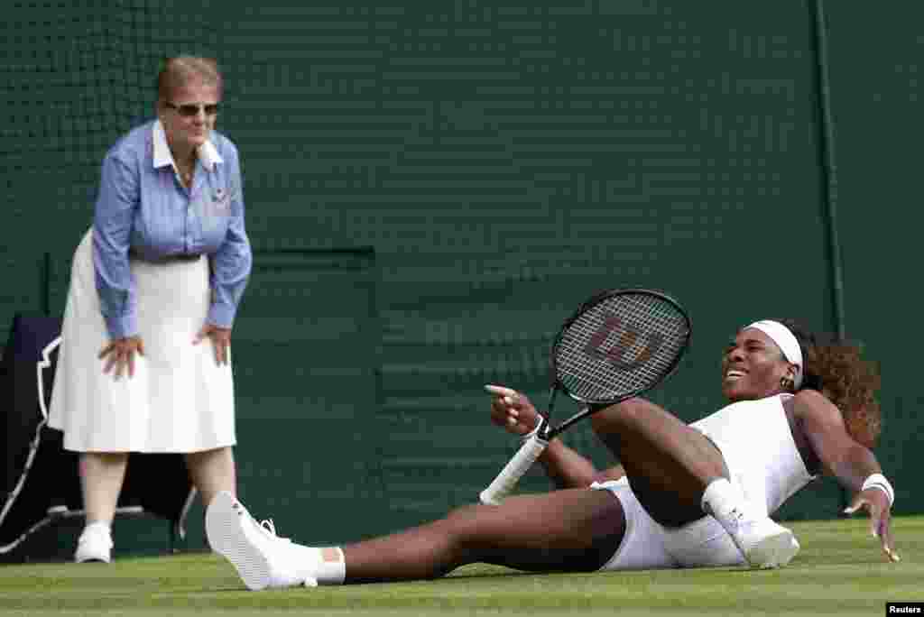 Serena Williams of the U.S. slips during her women's singles tennis match against Anna Tatishvili of the U.S. at the Wimbledon Tennis Championships, in London.