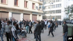 Algerian youth protesters clash with riot police in Annaba, February 13, 2011