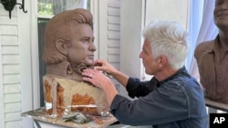 Artist Kevin Kresse, works on a clay bust of Johnny Cash, April 23, 2024 in Little Rock, Ark. Kresse's full sculpture of Cash will be unveiled at the U.S. Capitol as part of the Statuary Hall collection later this year.