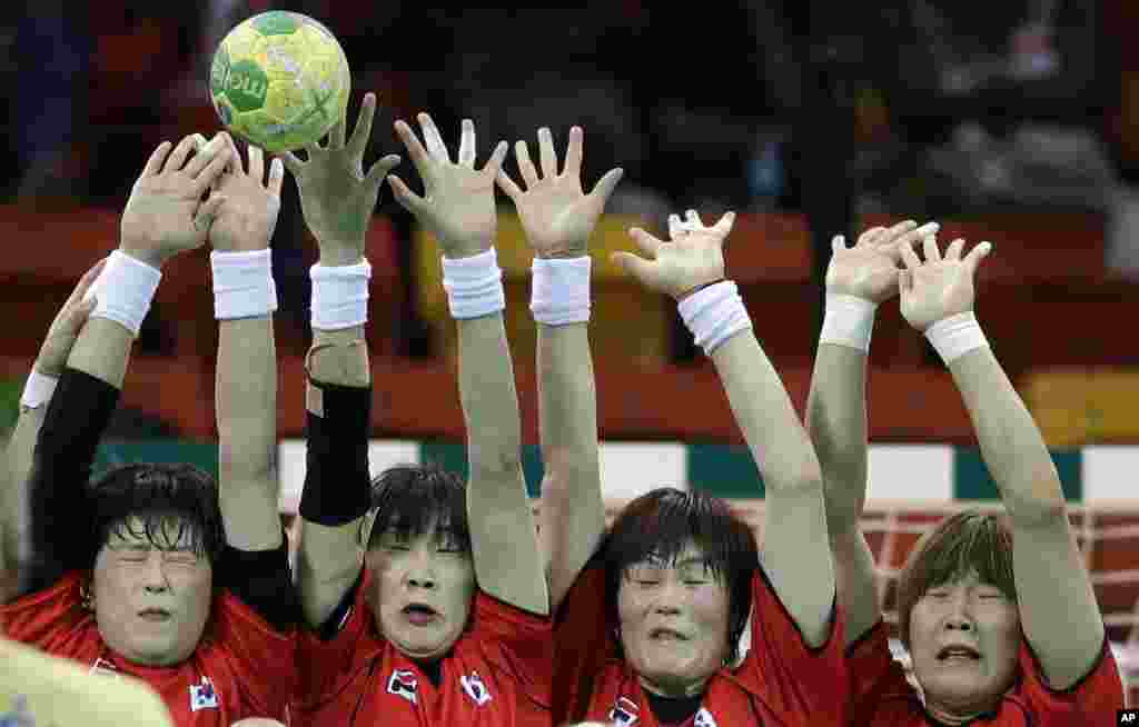 Sweden's Nathalie Hagman, not in the picture, scores a penalty past the South Korean defense during the women's preliminary handball match between Sweden and South Korea at the 2016 Summer Olympics in Rio de Janeiro, Brazil.