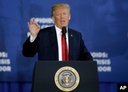 FILE - President Donald Trump speaks about his plan to combat opioid drug addiction, at Manchester Community College, March 19, 2018, in Manchester, N.H.