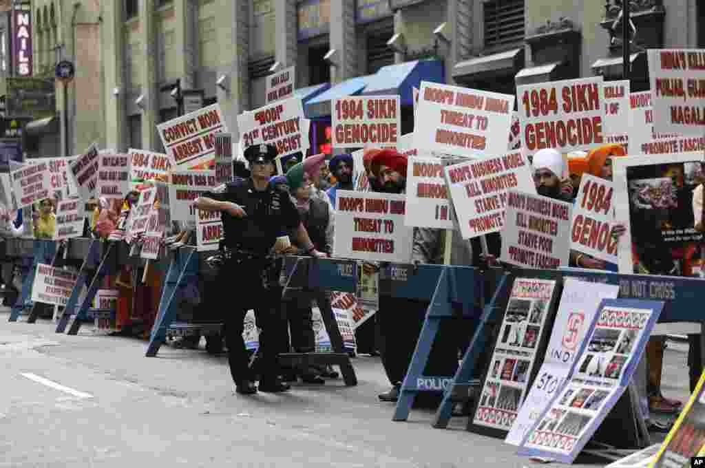 Protesters stage a demonstration against Indian Prime Minister Narendra Modi where he spoke to a capacity crowd from the Indian-American community, across the street from Madison Square Garden, New York, Sept. 28, 2014.