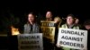 Protesters from the Border Communities Against Brexit group hold a demonstration on the Irish border on the Republic of Ireland side close to the town of Jonesborough, Ireland, Oct. 16 , 2019. 