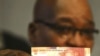 South Africa's President Jacob Zuma holds up a banknote bearing the face of former president Nelson Mandela in Pretoria February 11, 2012.
