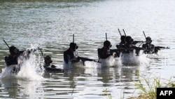 Troops take part in training at a base of the Korean People's Army's special operations forces, at an undisclosed location in North Korea, in this picture taken Oct. 2, 2024, and released by the Korean Central News Agency via KNS on Oct. 4, 2024. 