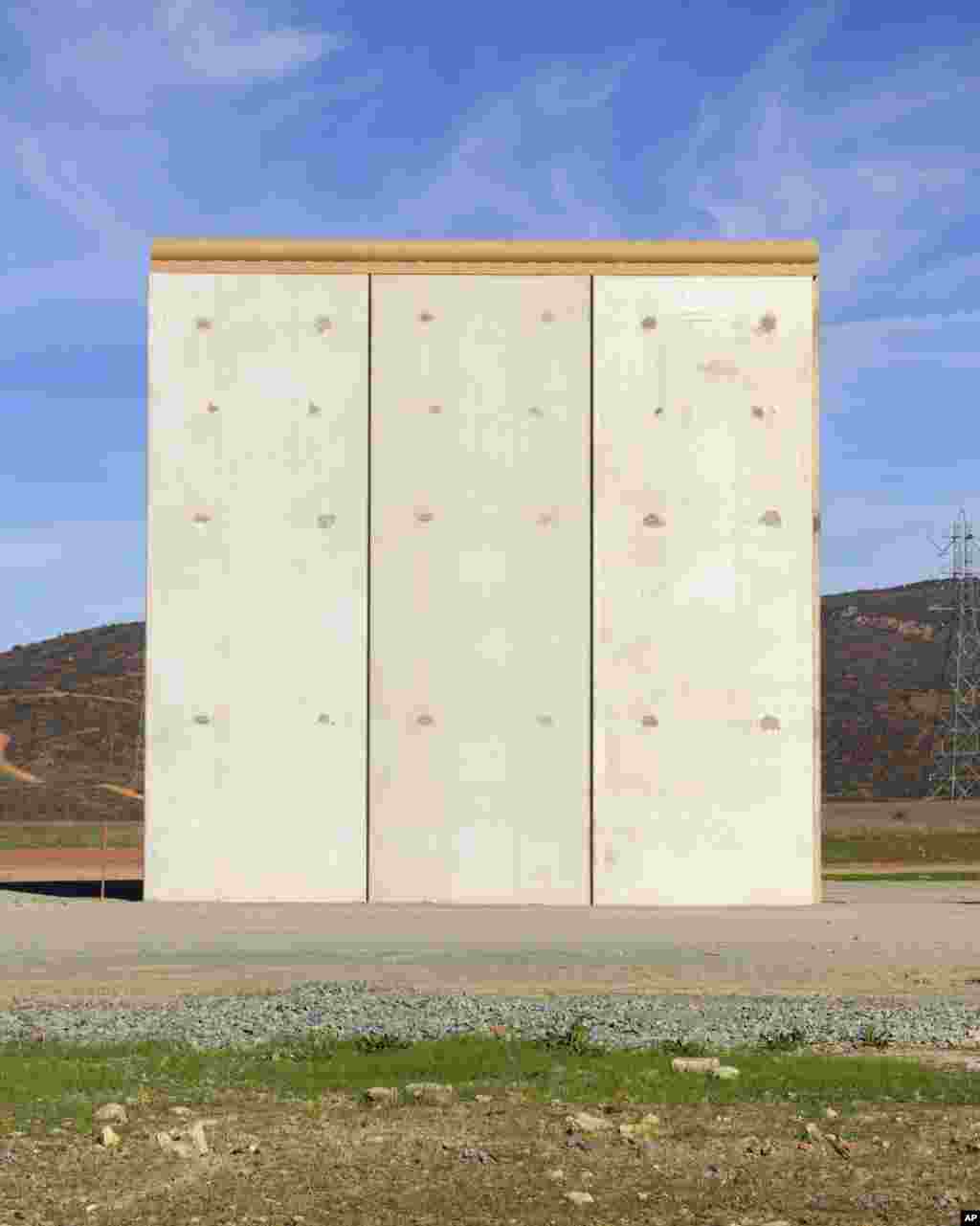 A border wall prototype stands in San Diego near the Mexico-U.S. border, seen from Tijuana, Mexico, Dec. 22, 2018. 